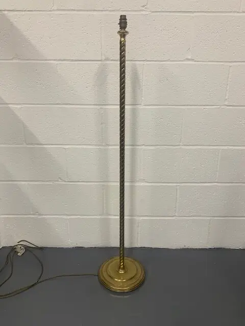 A floor lamp with a metal base and a light bulb.