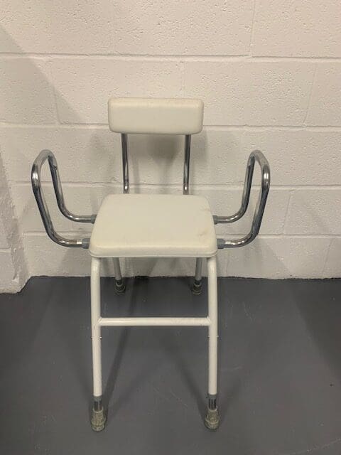 A white chair with arms on the back.