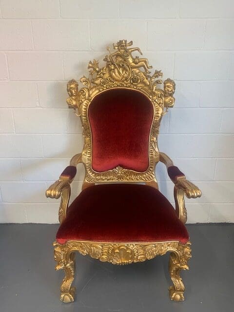 A red and gold chair with arms on the back.