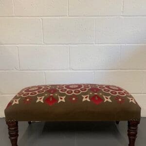 A bench with a brown and red pattern on it.