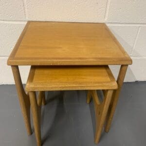 A pair of wooden tables sitting on top of each other.