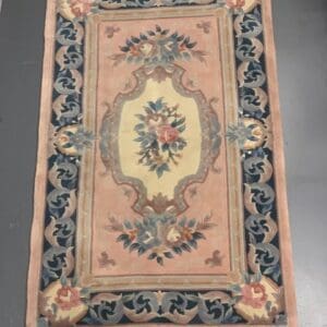 A rug with a floral design on it.