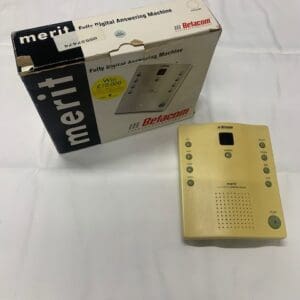 A gold colored box with a remote control on it.