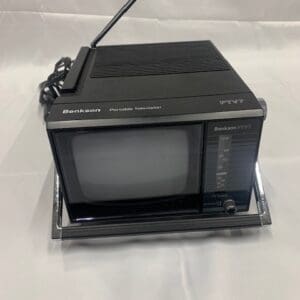 A small black television sitting on top of a table.