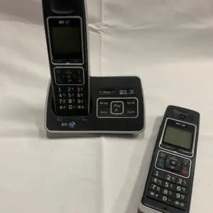 A couple of phones sitting on top of a table.