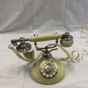 A vintage telephone sitting on top of a table.