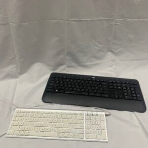 A keyboard and mouse sitting on top of a table.