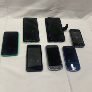 A table with several different types of cell phones.