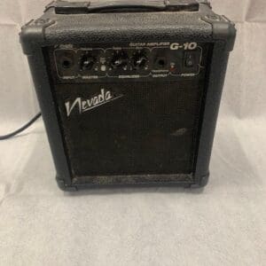 A black amp sitting on top of a table.