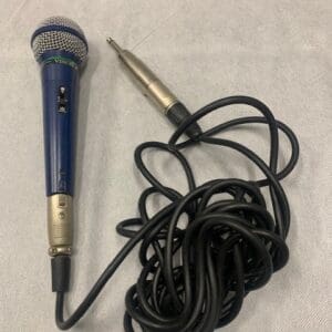 A microphone and some black cords on the floor