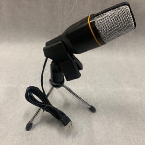 A microphone is sitting on top of a tripod.