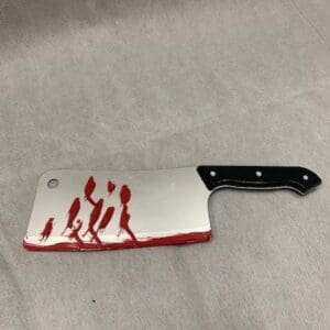 A bloody knife with blood on it.