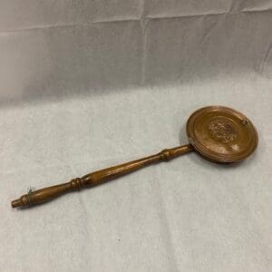 A wooden spoon sitting on top of a table.