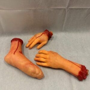 A pair of fake hands and feet with blood on them.