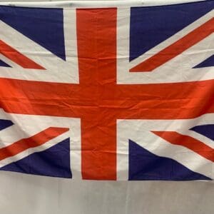 A flag of the united kingdom hanging on a wall.