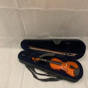 A violin and bow in an open case.