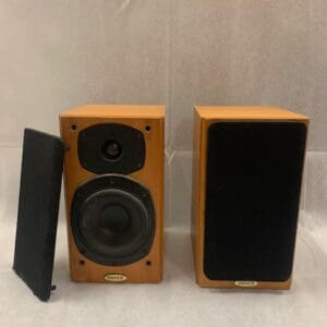 A pair of speakers sitting on top of a table.