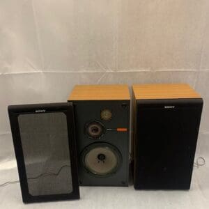 A pair of speakers and an ipod sitting on top of the floor.