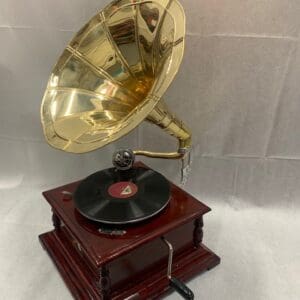 A record player with a gold plated horn.