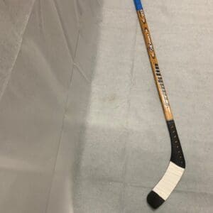 A hockey stick with the number 1 2 on it.