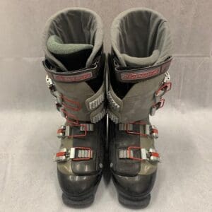 A pair of ski boots sitting on top of a white table.