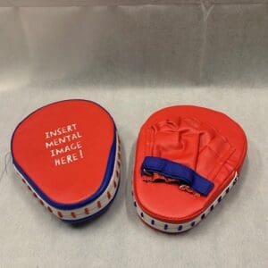 A pair of red and blue pads on top of a table.