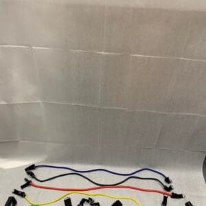 A white sheet with wires and wires on it