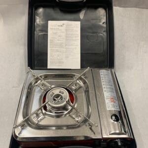 A silver stove sitting in an open case.