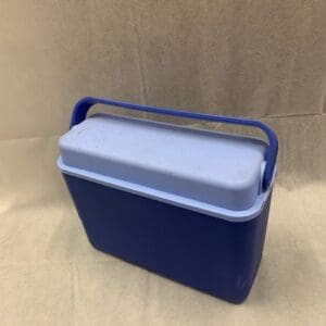 A blue cooler sitting on top of a table.