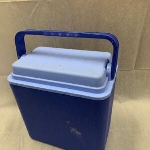 A blue cooler sitting on top of a table.