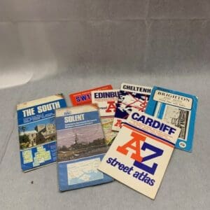 A group of six books on the subject of street atlas.