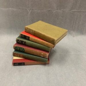 A stack of six books on top of each other.