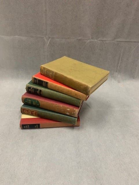 A stack of six books on top of each other.