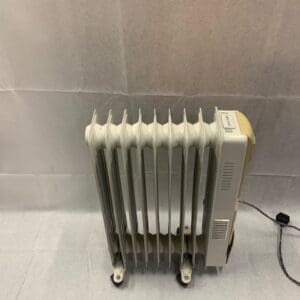 A radiator heater sitting on top of the floor.