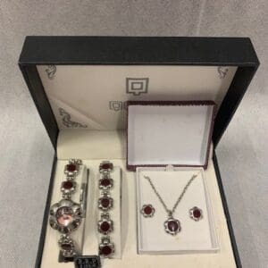 A watch and jewelry set in a box.