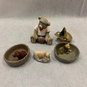 A group of small figurines sitting on top of a table.