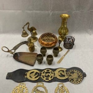 A table with various items and some gold colored objects.