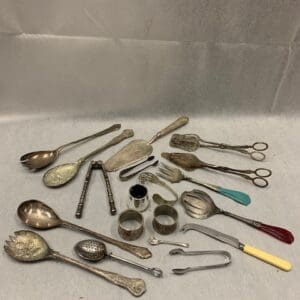 A table with many different spoons and other items