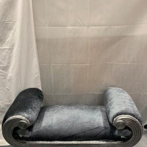 A bench in the corner of a bathroom