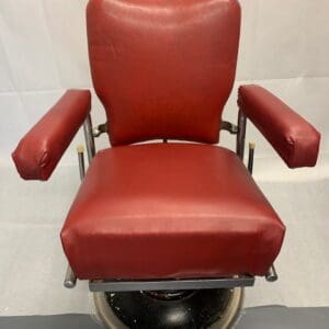 A red chair with metal frame and seat.