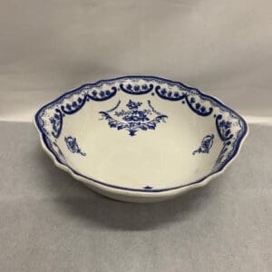 A bowl with blue and white design on it.