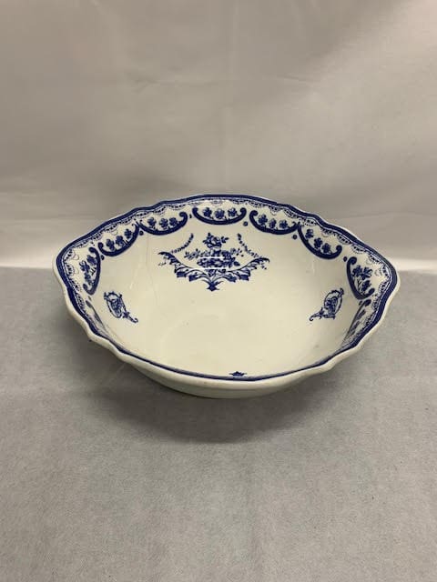 A bowl with blue and white design on it.