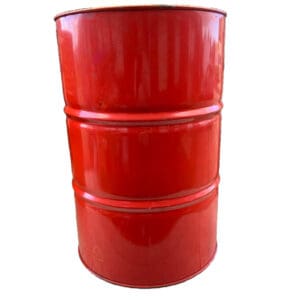 A red barrel sitting on top of a white table.