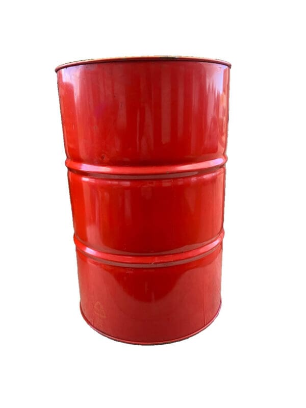 A red barrel sitting on top of a white table.