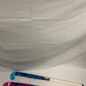 A white sheet with two hockey sticks on it