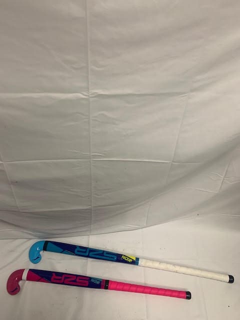 A white sheet with two hockey sticks on it