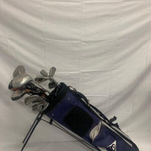 A bag of golf clubs and a white background