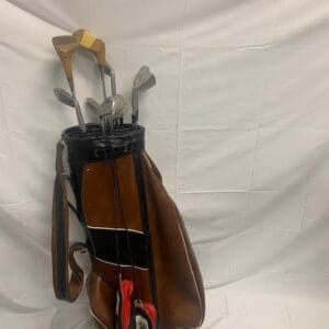 A bag of golf clubs hanging on the wall