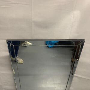 A mirror with two mirrors on the side of it.