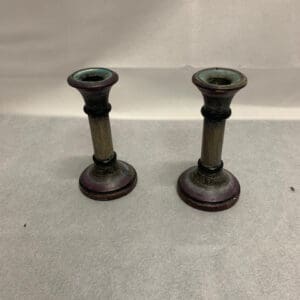 A pair of candlesticks sitting on top of a table.